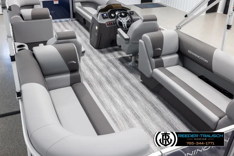 Slide: The Image of 2025 Bennington 23 SSRSE pontoon boat interior with luxurious seating and modern dashboard. - 11