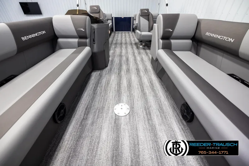 Slide: The Image of Interior of 2025 Bennington 23 SSRSE pontoon boat with gray seating and carpeted floor. - 13