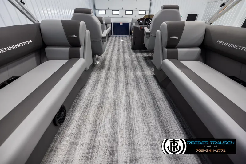Slide: The Image of Interior of 2025 Bennington 23 SSRSE pontoon boat with gray seating and carpeted flooring. - 16