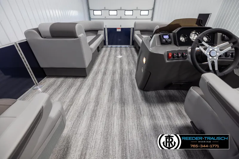 Slide: The Image of 2025 Bennington 23 SSRSE pontoon boat interior with modern seating and steering console. - 17