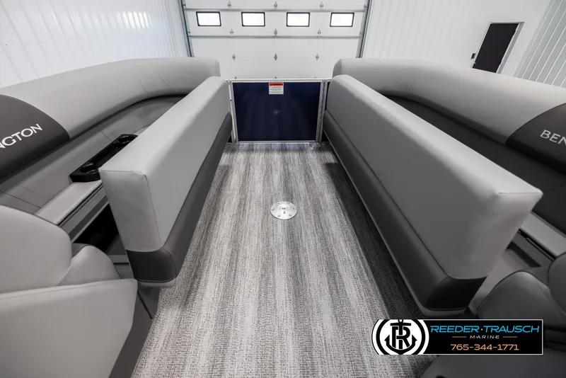 Slide: The Image of 2025 Bennington 23 SSRSE pontoon boat interior with gray seating and carpeted flooring. - 19
