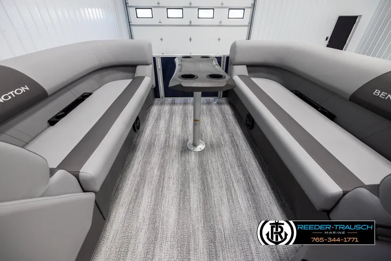 Slide: The Image of 2025 Bennington 23 SSRSE pontoon boat interior with gray seating and central table. - 20
