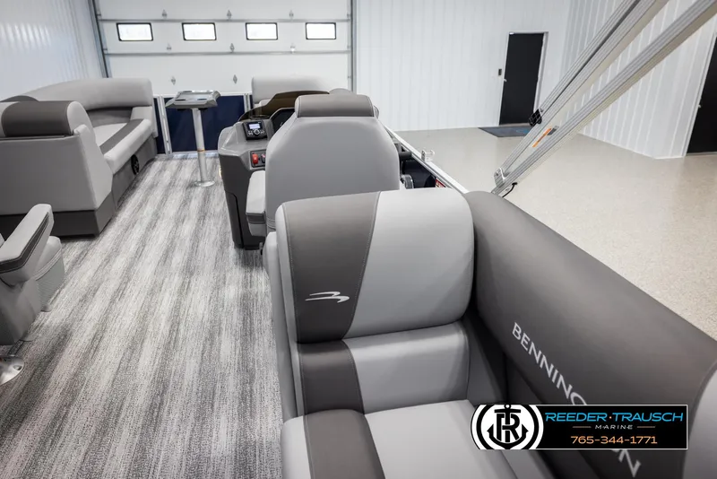 Slide: The Image of Interior of 2025 Bennington 23 SSRSE pontoon boat with modern seating and sleek design. - 23