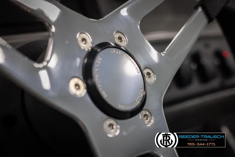 Slide: The Image of Close-up of 2025 Bennington 23 SSRSE steering wheel with logo detail. - 27