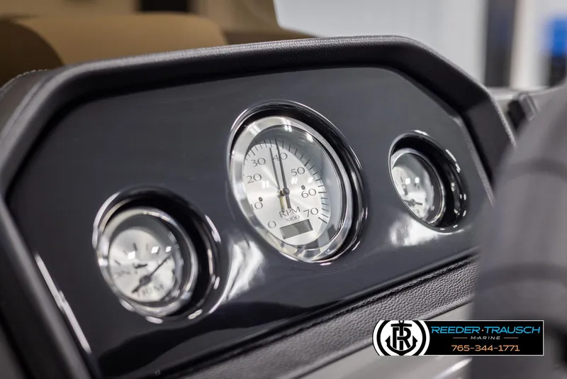 Slide: The Image of Dashboard of 2025 Bennington 23 SSRSE boat with gauges and Reeder-Trausch Marine logo. - 30
