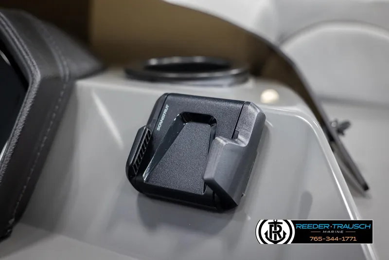 Slide: The Image of Close-up of a 2025 Bennington 23 SSRSE boat dashboard with a mounted device. - 31