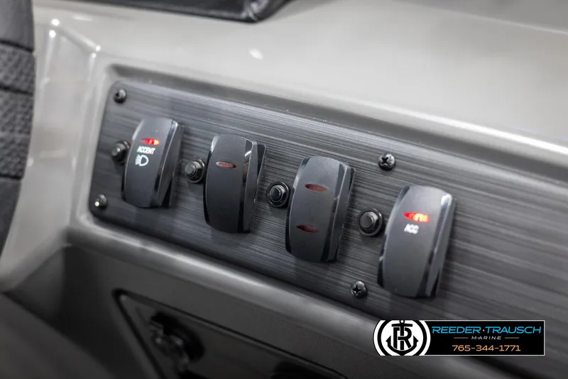 Slide: The Image of Dashboard switches on a 2025 Bennington 23 SSRSE boat, featuring accent lighting controls. - 32