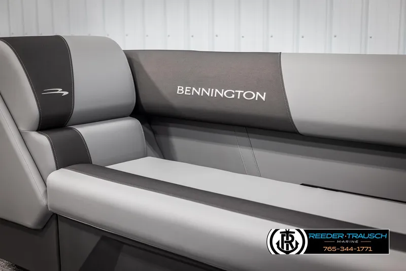 Slide: The Image of 2025 Bennington 23 SSRSE boat interior seating with logo, featuring sleek gray upholstery. - 35