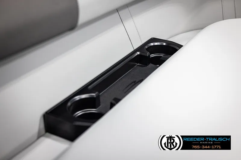 Slide: The Image of 2025 Bennington 23 SSRSE boat interior with cup holders, featuring sleek white seating. - 39