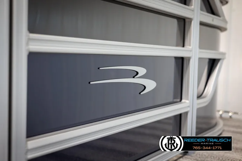Slide: The Image of 2025 Bennington 23 SSRSE boat detail with logo, showcased by Reeder-Trausch Marine. - 44