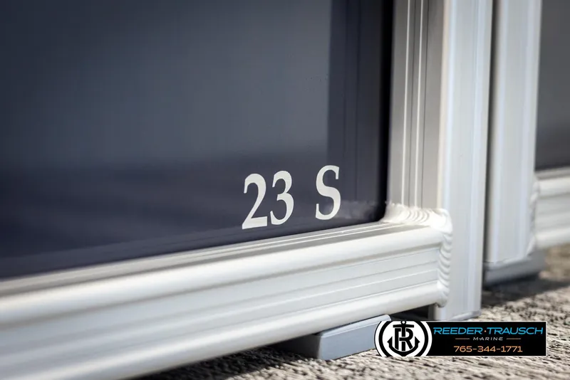 Slide: The Image of 2025 Bennington 23 SSRSE boat detail with Reeder-Trausch Marine logo. - 45
