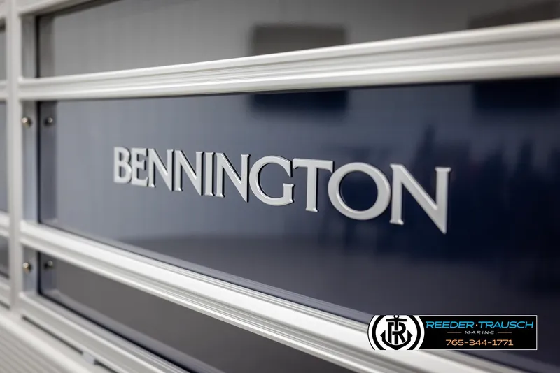 Slide: The Image of Close-up of 2025 Bennington 23 SSRSE boat logo on sleek blue surface. - 46