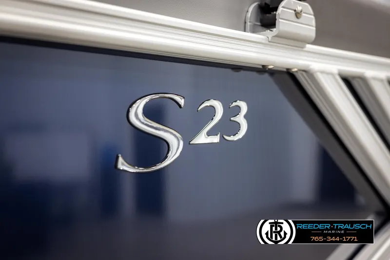 Slide: The Image of 2025 Bennington 23 SSRSE boat with "S 23" emblem, Reeder-Trausch Marine logo visible. - 47
