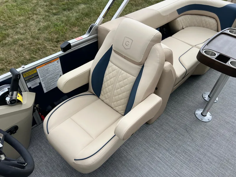 Slide: The Image of Luxurious seating on 2025 Godfrey SWEETWATER 2286 SB pontoon boat, featuring beige upholstery. - 18