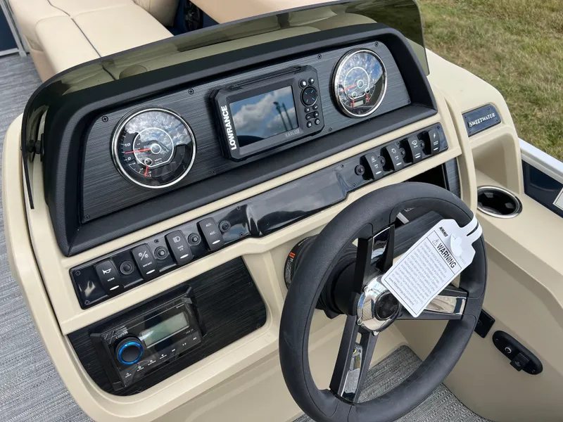 Slide: The Image of 2025 Godfrey SWEETWATER 2286 SB dashboard with steering wheel and control panel. - 28