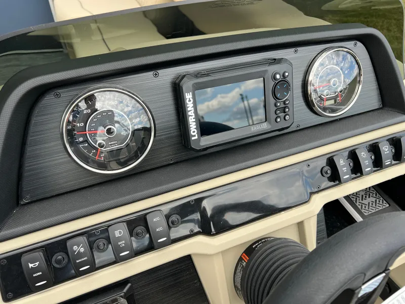 Slide: The Image of Dashboard of 2025 Godfrey SWEETWATER 2286 SB with gauges and Lowrance display. - 29