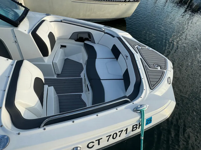 Slide: The Image of 2022 Monterey M-45 boat with sleek seating and modern design on the water. - 14