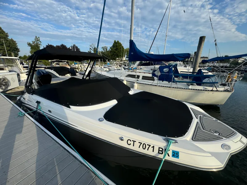 Slide: The Image of 2022 Monterey M-45 boat docked at marina with cover. - 2