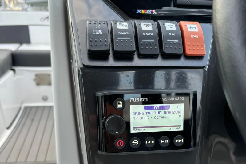 Slide: The Image of Control panel of 2022 Monterey M-45 boat with music display and switches. - 23