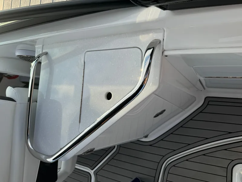 Slide: The Image of 2022 Monterey M-45 boat interior with sleek chrome railing and modern design. - 28