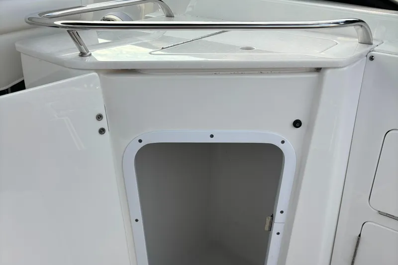 Slide: The Image of 2022 Monterey M-45 boat storage compartment with open door and stainless steel railing. - 32