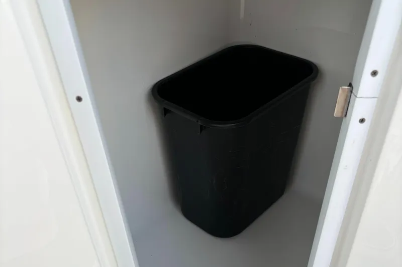 Slide: The Image of Black trash bin inside a white cabinet, Monterey M-45, 2022 model. - 35