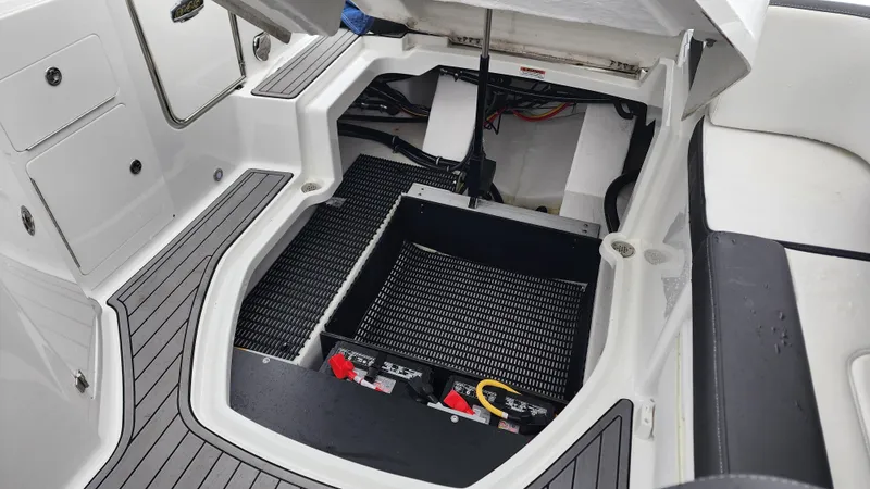 Slide: The Image of 2022 Monterey M-45 boat battery compartment with open hatch and visible wiring. - 39