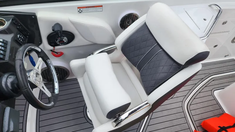 Slide: The Image of 2022 Monterey M-45 boat interior with sleek steering wheel and cushioned seating. - 45
