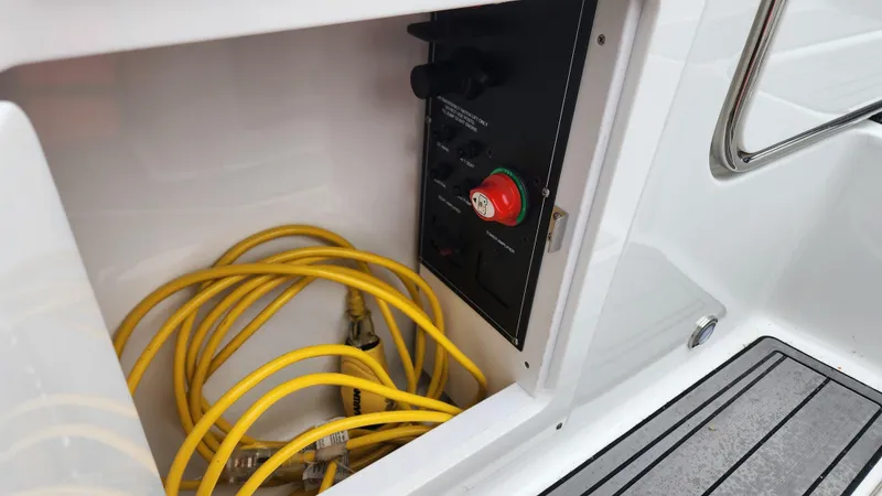 Slide: The Image of Yellow cables and control panel in 2022 Monterey M-45 boat compartment. - 47