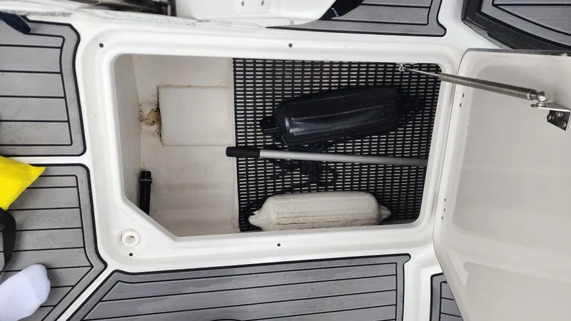 Slide: The Image of Open storage compartment on 2022 Monterey M-45 boat with fenders and equipment. - 49