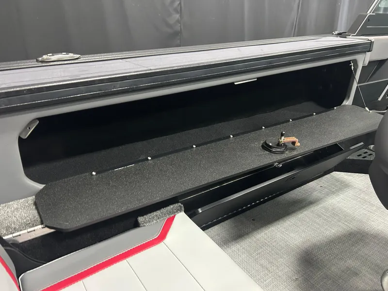 Slide: The Image of 2025 Alumacraft Trophy 185X Sport boat interior storage compartment, open and empty. - 16