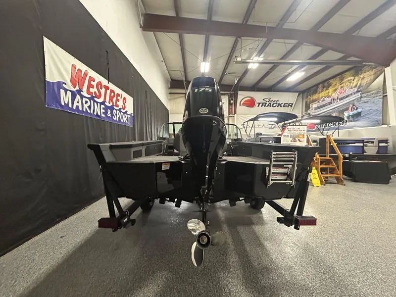 Slide: The Image of 2025 Alumacraft Trophy 185X Sport boat displayed indoors at Westre's Marine & Sport. - 4