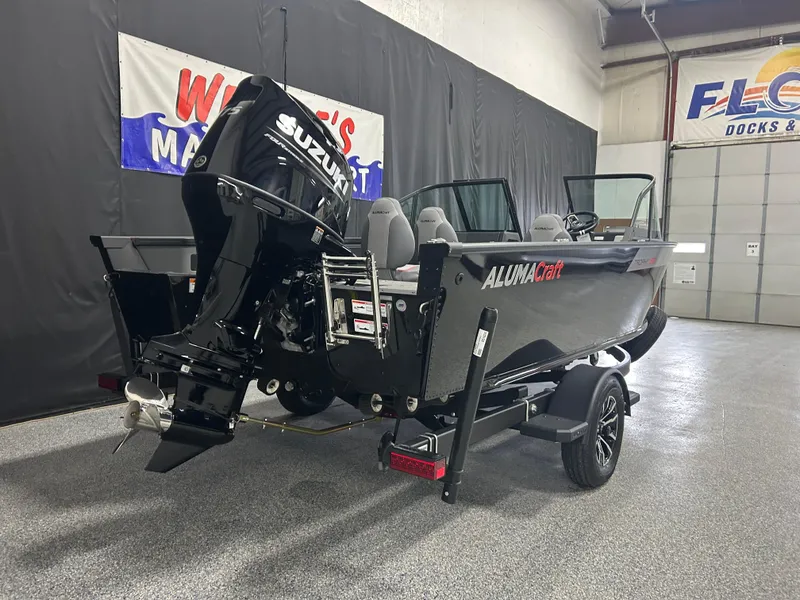 Slide: The Image of 2025 Alumacraft Trophy 185X Sport boat with Suzuki outboard motor in showroom. - 5