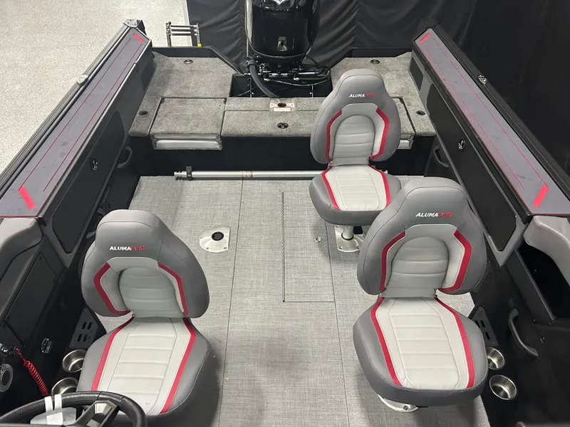 Slide: The Image of 2025 Alumacraft Trophy 185X Sport interior with four gray and red seats, spacious layout. - 9