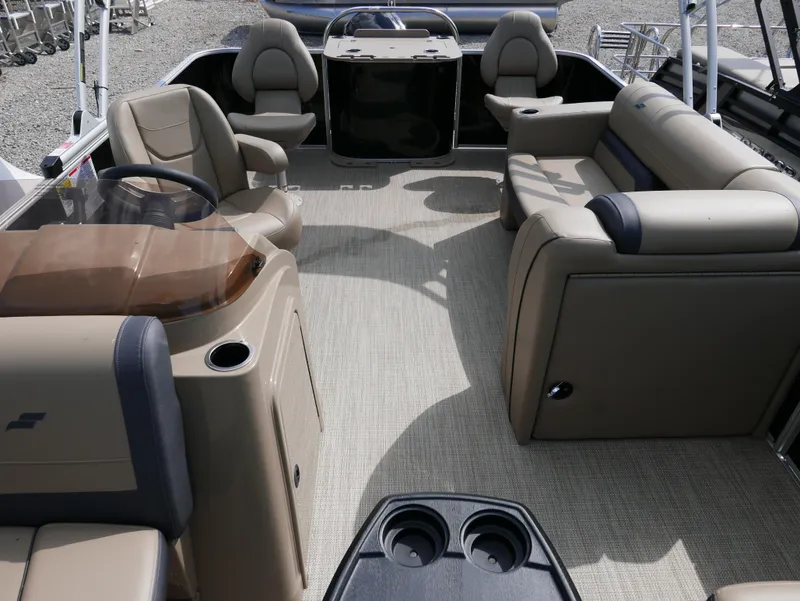 Slide: The Image of 2025 Starcraft EX Fish 20 FD boat interior with beige seating and modern design. - 11