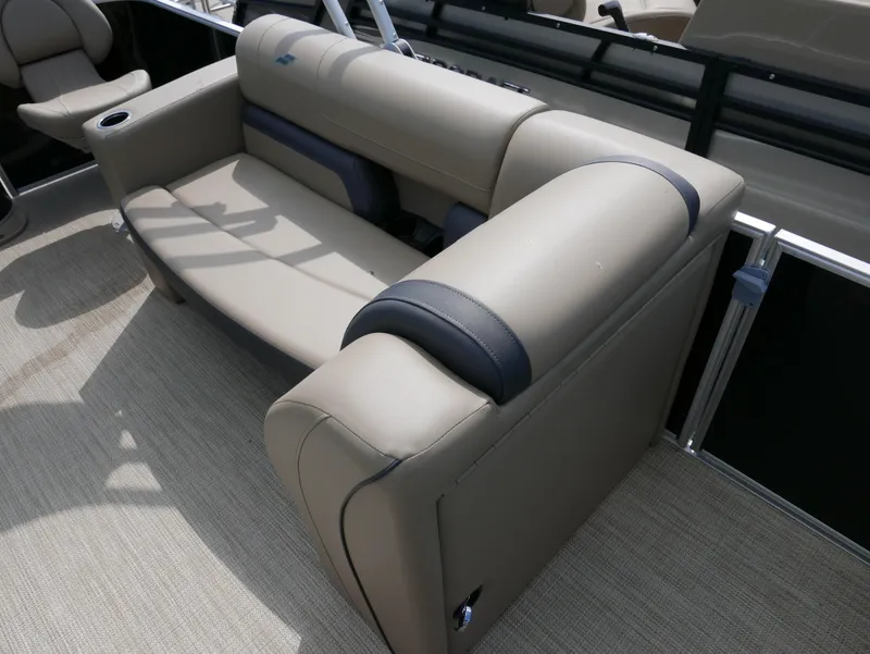 Slide: The Image of 2025 Starcraft EX Fish 20 FD boat interior with beige seating and cup holder. - 12