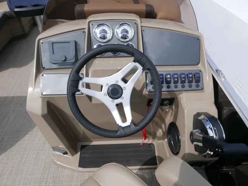 Slide: The Image of 2025 Starcraft EX Fish 20 FD boat dashboard with steering wheel and control panel. - 16