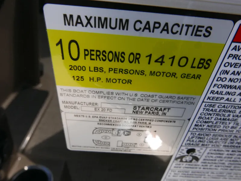 Slide: The Image of Starcraft EX Fish 20 FD 2025 boat capacity label, 10 persons or 1410 lbs, 125 HP motor. - 17