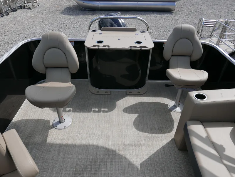 Slide: The Image of 2025 Starcraft EX Fish 20 FD boat interior with seating and console. - 19