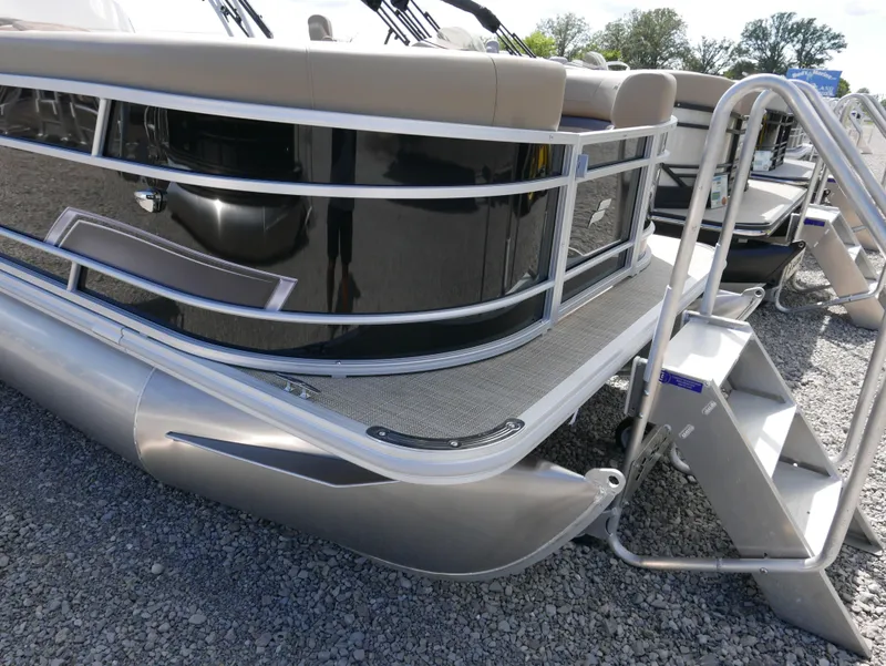 Slide: The Image of 2025 Starcraft EX Fish 20 FD pontoon boat with sleek design and sturdy railing. - 2