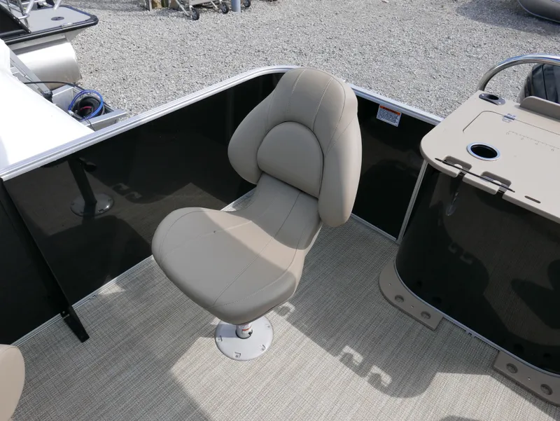 Slide: The Image of Starcraft EX Fish 20 FD 2025 boat seat with beige upholstery and sleek design. - 20