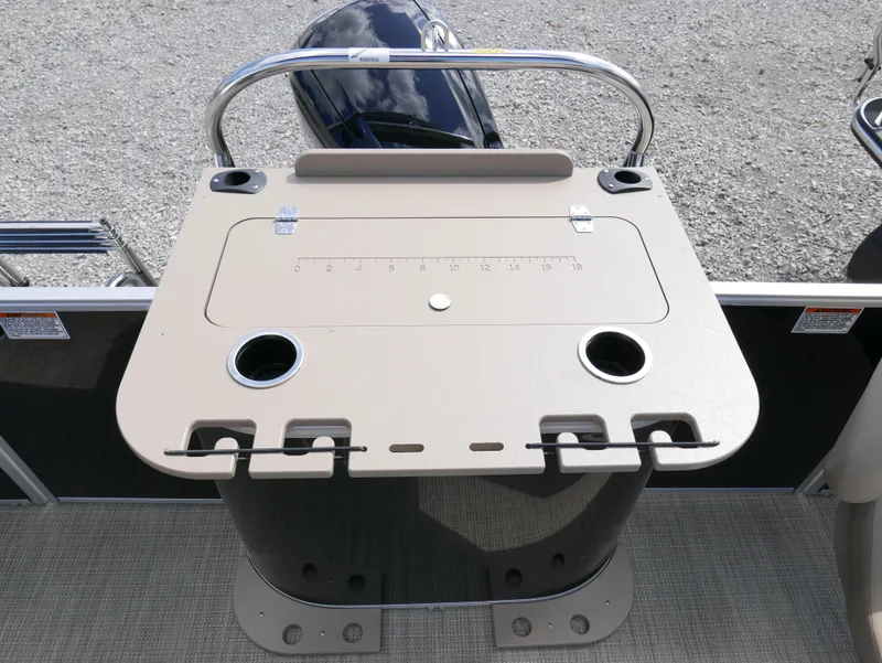 Slide: The Image of Starcraft EX Fish 20 FD 2025 boat console with cup holders and storage. - 21