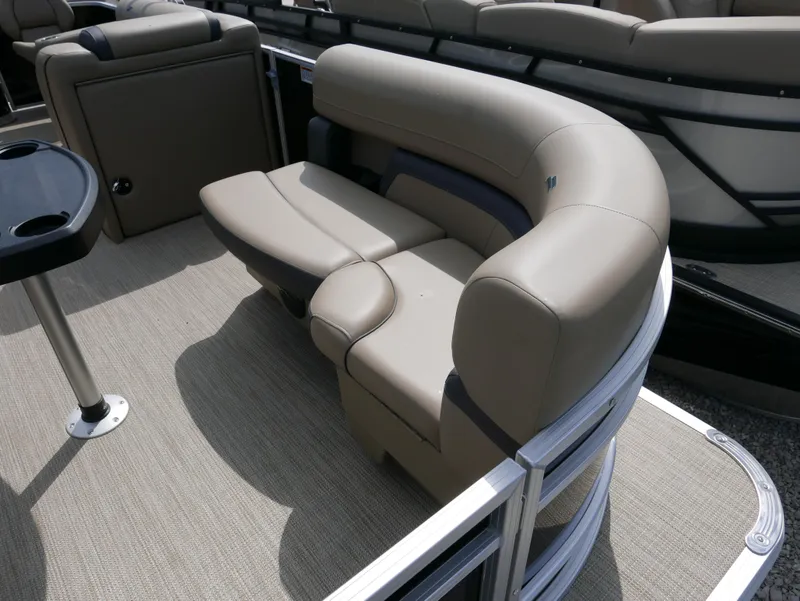 Slide: The Image of 2025 Starcraft EX Fish 20 FD boat interior with beige seating and cup holder. - 8