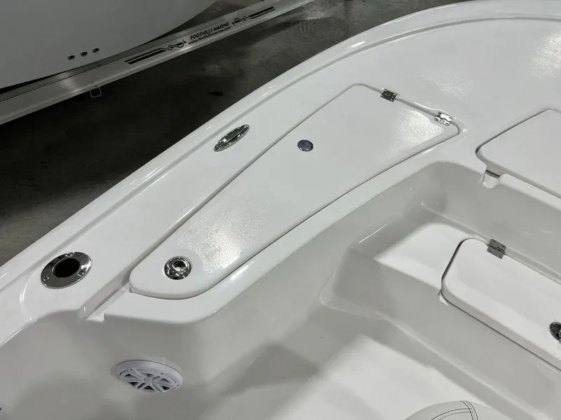 Slide: The Image of 2025 Tidewater 2110 Bay Max boat interior, featuring sleek white storage compartments. - 6