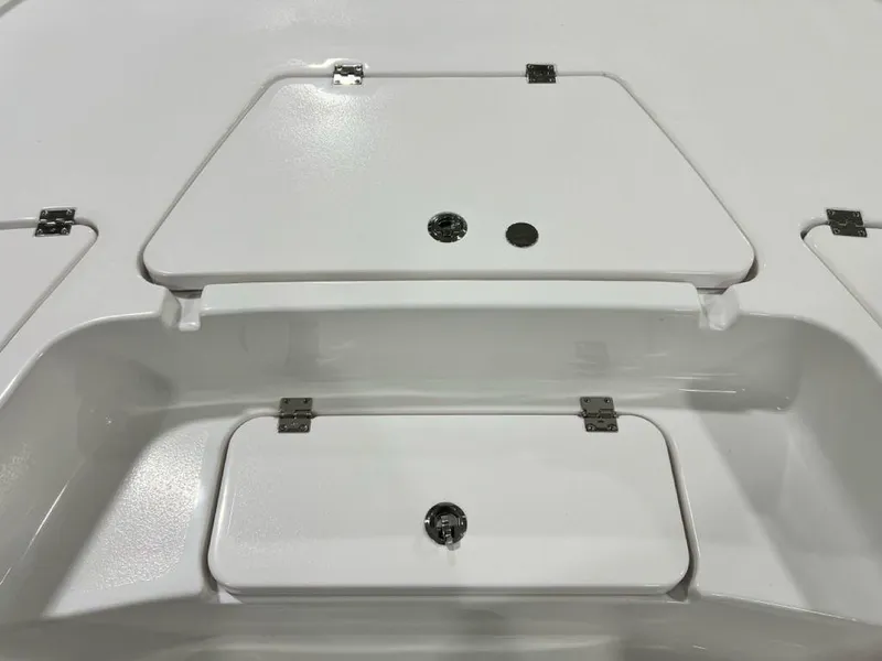 Slide: The Image of 2025 Tidewater 2110 Bay Max boat storage compartments, featuring secure latches and sleek design. - 8