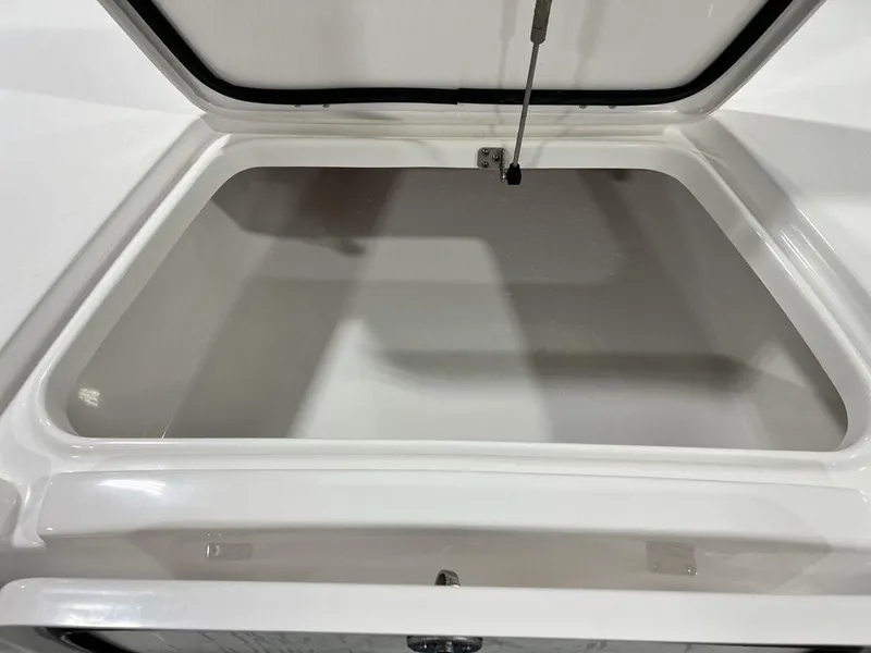 Slide: The Image of Open storage compartment of 2025 Tidewater 2110 Bay Max boat. - 9