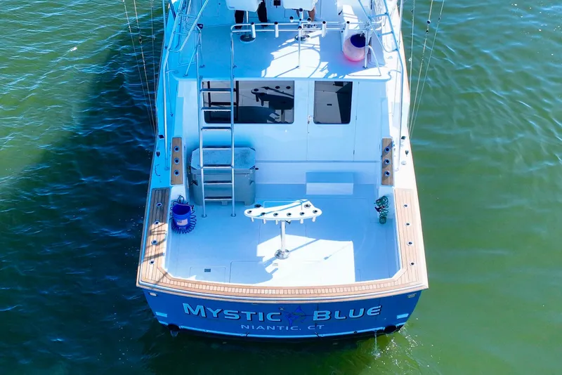 Slide: The Image of Aerial view of 1982 Bertram 46 Convertible yacht, "Mystic Blue," on water. - 11