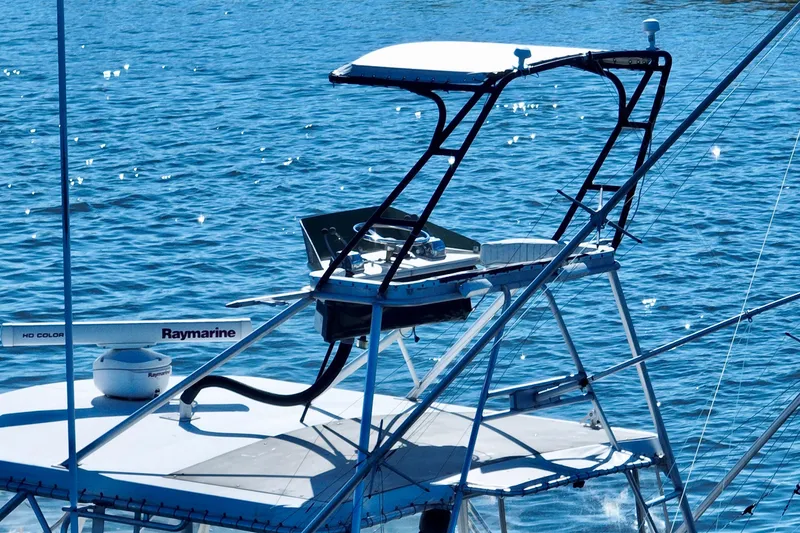 Slide: The Image of 1982 Bertram 46 Convertible boat with Raymarine equipment on blue water. - 12