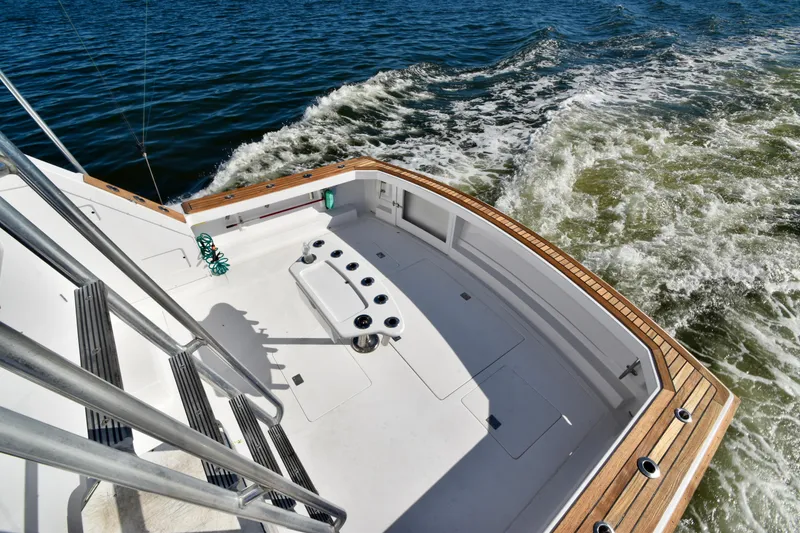 Slide: The Image of 1982 Bertram 46 Convertible boat deck on open water. - 36