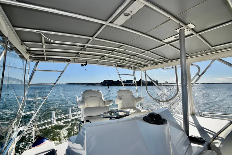 Slide: The Image of Interior view of 1982 Bertram 46 Convertible yacht on open water. - 43